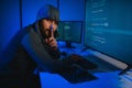 Hacker Using Multiple Computers For Stealing Data On Desk Royalty Free Stock Photo