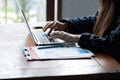 Hacker woman stealing data by using laptop