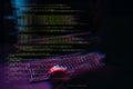 Hacker working with computer in dark room with digital interface around. Image with glitch effect. Royalty Free Stock Photo