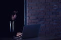 Hacker working on his computer, Hacker stealing password and dat Royalty Free Stock Photo