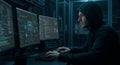 Hacker Working Late at Night A hooded figure intensely focuses on multiple computer screens displaying complex code symbolizing Royalty Free Stock Photo