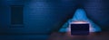 The hacker works behind a laptop screen in a room with a brick wall. Internet crime. The concept of hacking and malware