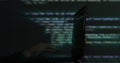 Hacker writing code cracking computer. Programming code in the background. Hacker attack, cybercrime, virus software, dark web,
