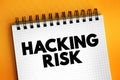 Hacking Risk - act of gaining unauthorized access to data in a system or computer, text concept on notepad