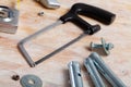 Hacksaw among various construction tools Royalty Free Stock Photo