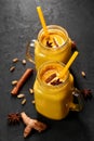 Hadi Doodh know as Golden Turmeric Milk in Mason Jar on black slate background. Golden Milk is ayurvedic recipe of hot milk with Royalty Free Stock Photo