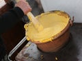 Cook during the preparation of POLENTA a typical dish with boile