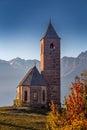 Hafling, Italy - The mountain church of St. Catherine Chiesa di Santa Caterina near Hafling - Avelengo on a warm autumn sunset