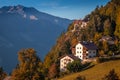 Hafling, Italy - Traditional tirol houses at Hafling - Avelengo on a warm autumn sunset with the Italian Dolomites in South Tyrol Royalty Free Stock Photo