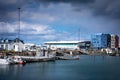 Hafnafjordur fishing harbour in Iceland - small boats and colourful port buildings.