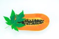 Haft cut papaya fruit and papaya leaf Royalty Free Stock Photo