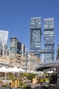 Hagag Group twin skyscrapers. Closeup. Blue sky and white clouds. Shot from below. Designed: Moshe Zur Architects and Urbanists