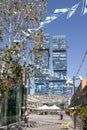 Hagag Group twin skyscrapers. Closeup. Blue sky and white clouds. Shot from below. Designed: Moshe Zur Architects and Urbanists