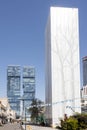 Hagag Group twin skyscrapers. Closeup. Blue sky and white clouds. Shot from below. Designed: Moshe Zur Architects and Urbanists