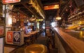 Empty retro style bar with vintage furniture, beer glasses, counter and old decorations