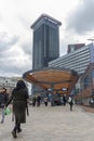 Hollands Spoor train station with trams and pedestrians