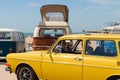 Brightly coloured VW kombi vans and Type 3 squareback parked at the beach on a sunny summer day Royalty Free Stock Photo