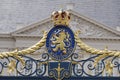The Hague, The Netherlands - May 15 2020. A view of a coat of arms with a crown, on the fence in front of Noordeinde Palace, royal Royalty Free Stock Photo