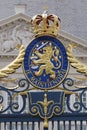 The Hague, The Netherlands - May 15 2020. A view of a coat of arms with a crown, on the fence in front of Noordeinde Palace, royal Royalty Free Stock Photo