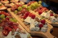 Cheese platter with fruits and meats nuts