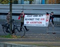 Participants of the anti-abortion demonstration holding a sign saying 