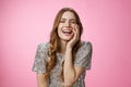 Haha so funny. Flirty coquettish attractive caucasian female laughing touching face feminine seduction gesture giggling Royalty Free Stock Photo