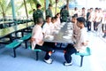 hai students are lining up in their school's canteen waiting for Royalty Free Stock Photo