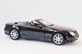 Hai, Ukraine - March 1, 2017: Mini copy of black toy car Mercedes- Benz SL 500 Convertible isolated on white background.