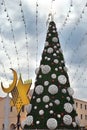 Christmas tree, Hanukkah menorah and crescent in Haifa, Israel