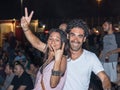 A young couple happily posing at the traditional annual beer festival in Haifa, Israel