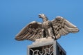 Decorative statue of a metal eagle with outstretched wings on the decorative metal entrance gate on the upper terrace of the Bahai