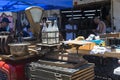 Antique Saturday market in old quarter. Four empty bottles in bottle holders in the backlight against Royalty Free Stock Photo