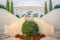 Beautiful installation in the Bahai Gardens. Two-way stairs and green bushes with flowers. Haifa, Israel. July 23, 2019.