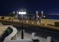 A decorative pillar with lanterns stands near the upper entrance to the Bahai Garden located on Louis Promenade at night in Haifa