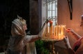 Believers women light candles at the entrance of the Russian Orthodox Church in Haifa city, in Israel Royalty Free Stock Photo