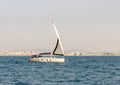 A private yacht sails in the waters of the Haifa Bay in the Mediterranean Sea, near the port of Haifa in Israel Royalty Free Stock Photo