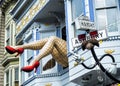 Haight-Ashbury, comic female legs with tights and red heels through window in a blue house - San Francisco, California, CA