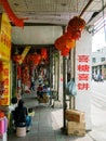 HAIKOU, HAINAN, CHINA - MAR 2 2019 Ã¢â¬â local shopkeepers along a five foot way at Bo`ai Road, a famous historic street in Haikou