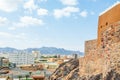 Hail city downtown and walls of Arabian Aarif fortress standing on the hill, Hail, Saudi Arabia