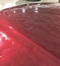 Hail damage on car hood Royalty Free Stock Photo