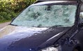 Hail damage to a car. Large hailstones have completely destroyed a car