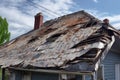 hail-damaged roof with visible dents and cracks