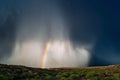 Hail and rain falling against a dramatic stormy sky background. Royalty Free Stock Photo