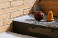 Hail on a terrace on the armchairs and next to the candle holders after the storm. Royalty Free Stock Photo