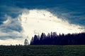 Hailstorm brewing over spring meadow and forest in German countryside Royalty Free Stock Photo