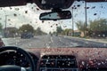 hailstorm pelting a car windshield