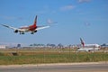 Hainan Airlines Boeing 787-9 Landing In Front Of Emirates Airbus A380 Royalty Free Stock Photo