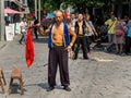 HAINAN, CHINA - 3 MAR 2019 Ã¢â¬â An Asian Chinese male martial artist performs in traditional costume at Feng Xiaogang movie town,