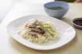 Hainanese chicken rice, Thai gourmet steamed chicken with rice served with sliced of cucumber and soup Royalty Free Stock Photo