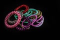 Hair accessories, colorful hair scrunchies isolated on black background